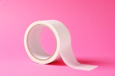 One masking tape on pink background, closeup