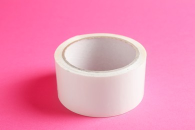 One masking tape on pink background, closeup