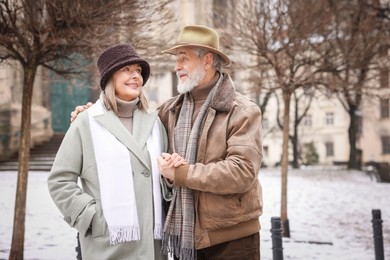 Photo of Portrait of happy senior couple on winter day