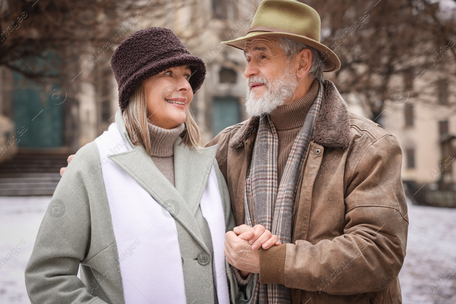 Photo of Portrait of happy senior couple on winter day