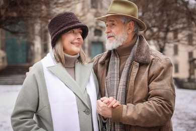 Photo of Portrait of happy senior couple on winter day