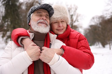 Photo of Happy senior couple enjoying time together at winter park