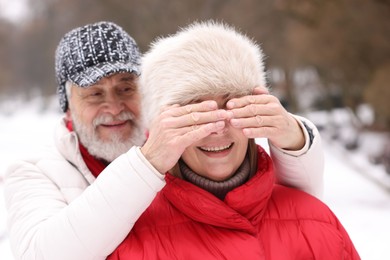 Photo of Lovely senior couple having fun in park