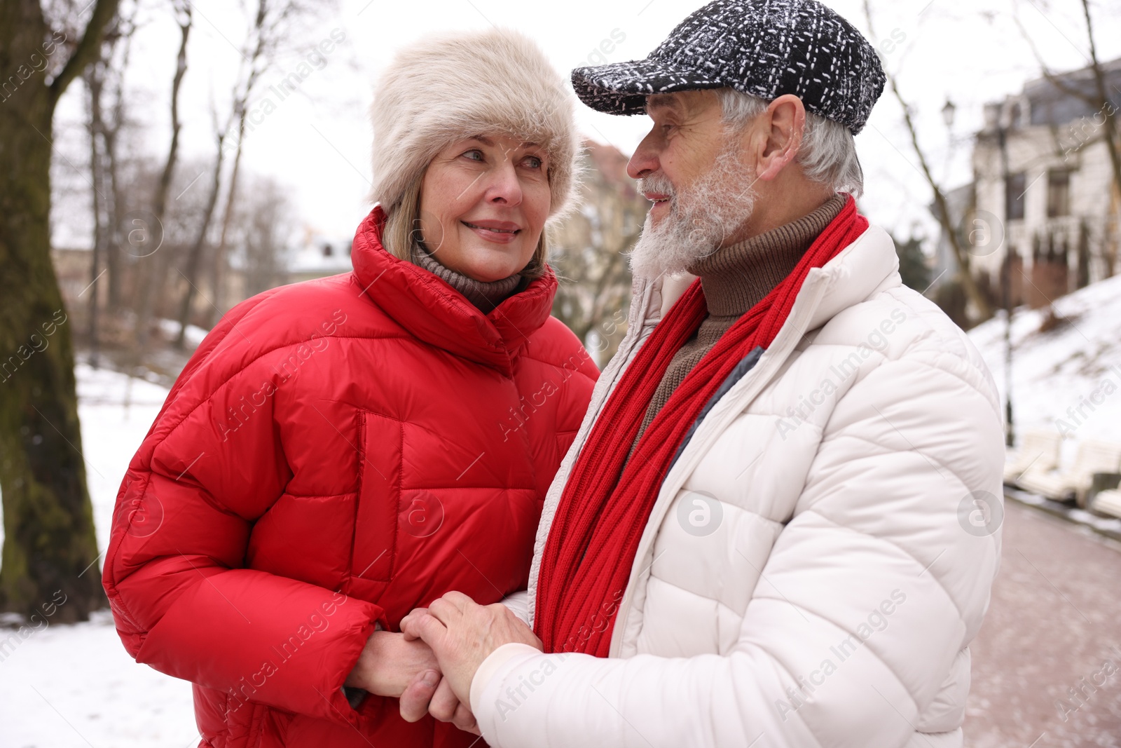 Photo of Lovely senior couple having fun on city street