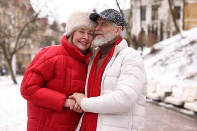 Photo of Lovely senior couple having fun on winter day