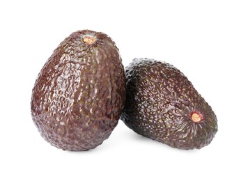 Photo of Two whole ripe avocados isolated on white