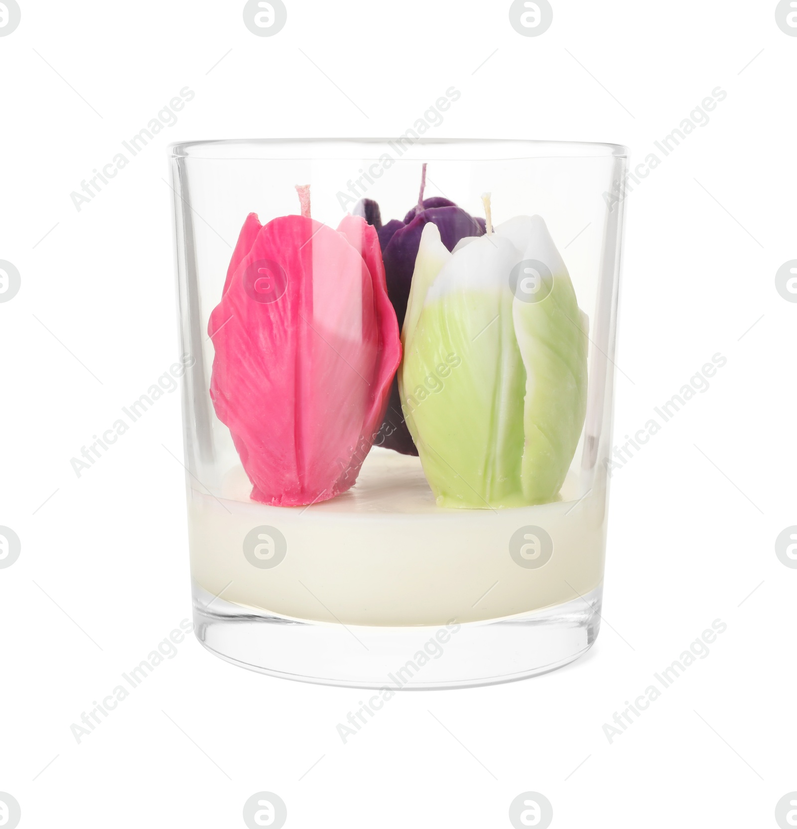 Photo of Beautiful flower-shaped candles in glass holder isolated on white