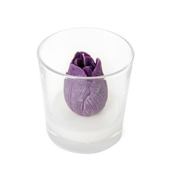 Photo of Beautiful violet flower-shaped candle isolated on white