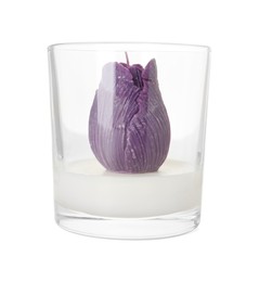 Photo of Beautiful violet flower-shaped candle isolated on white