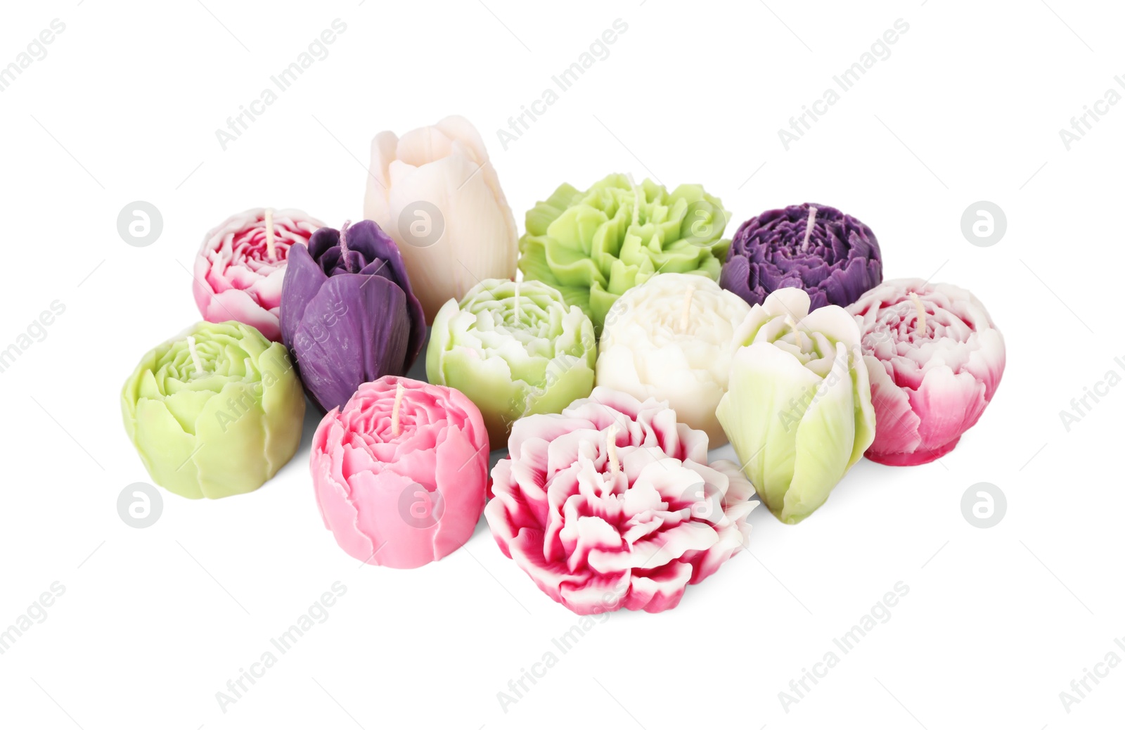 Photo of Many beautiful flower-shaped candles isolated on white