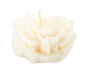 Photo of One beautiful flower-shaped candle isolated on white