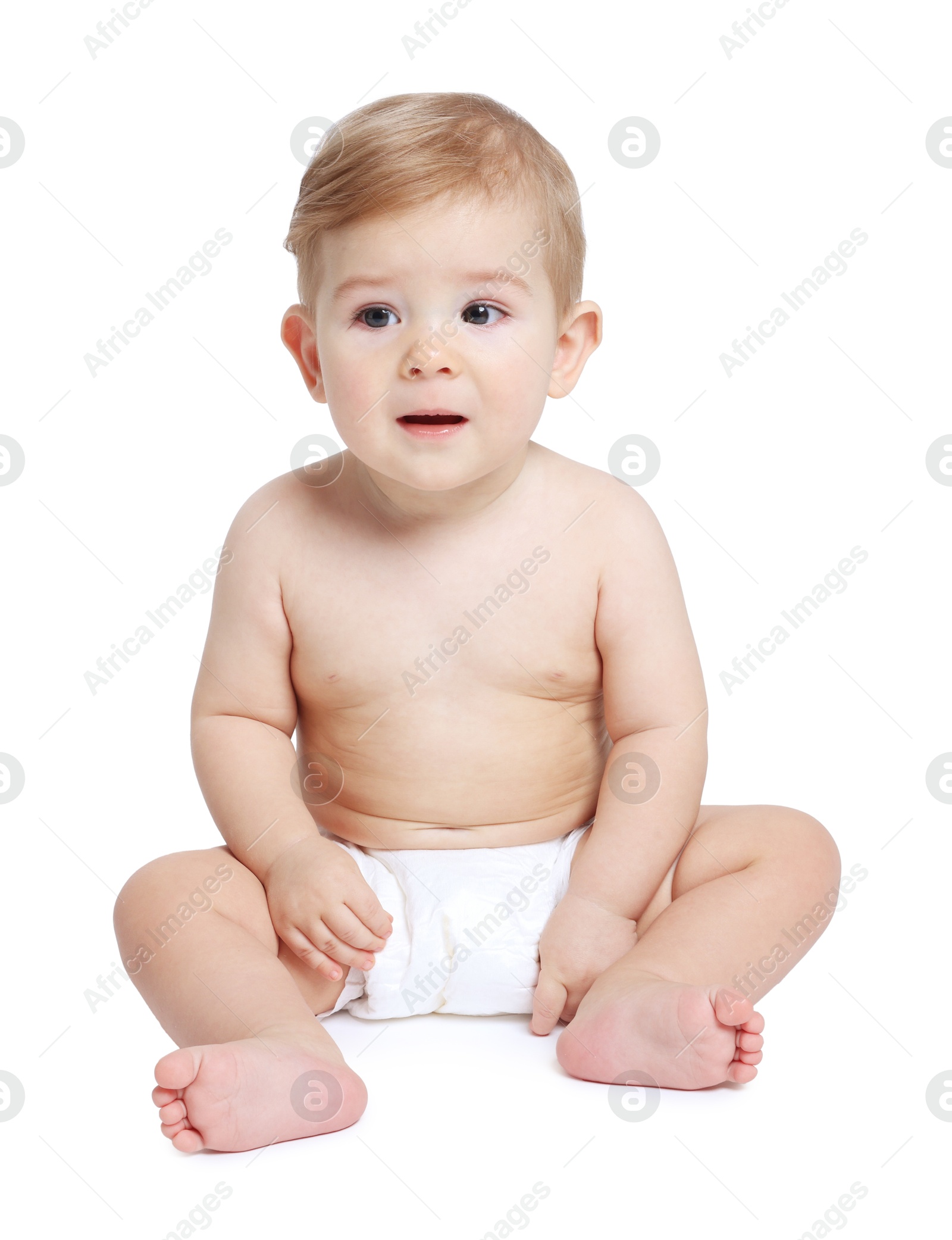 Photo of Cute little baby sitting on white background