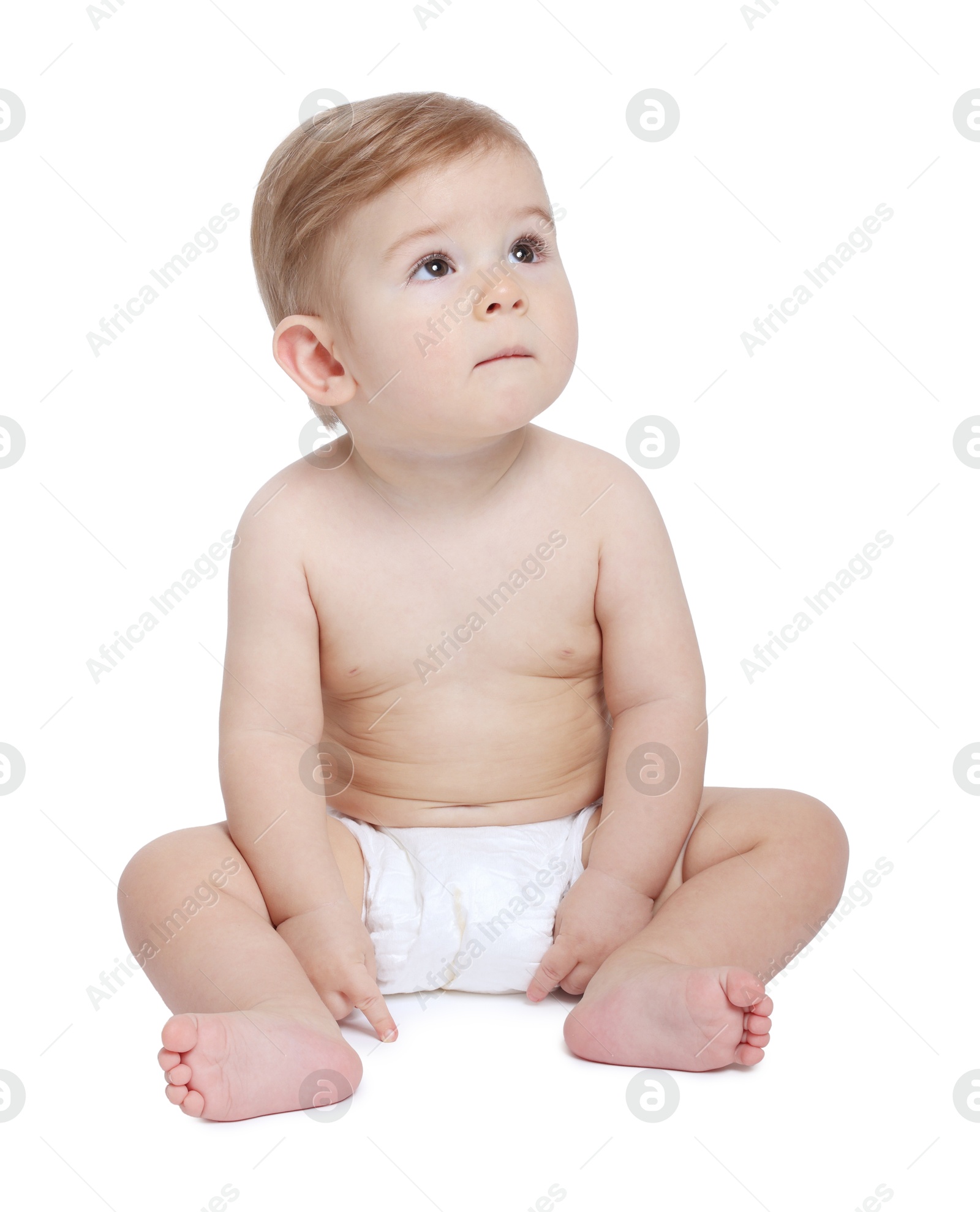 Photo of Cute little baby sitting on white background