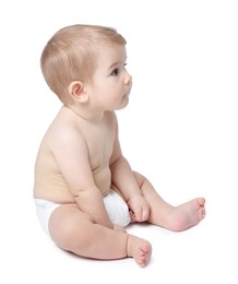 Photo of Cute little baby sitting on white background