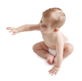 Photo of Cute little baby sitting on white background