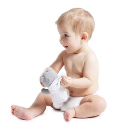 Photo of Cute little baby with toy on white background