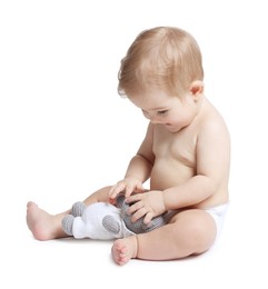 Photo of Happy little baby with toy on white background