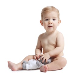 Photo of Cute little baby with toy on white background