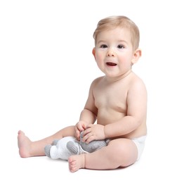 Photo of Cute little baby with toy on white background