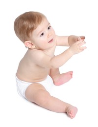 Photo of Cute little baby sitting on white background