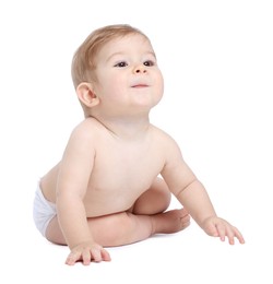 Photo of Cute little baby sitting on white background