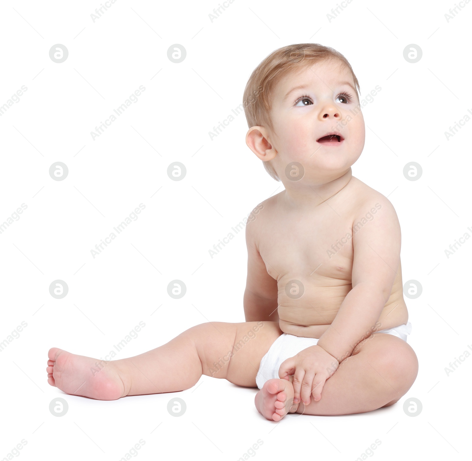 Photo of Cute little baby sitting on white background