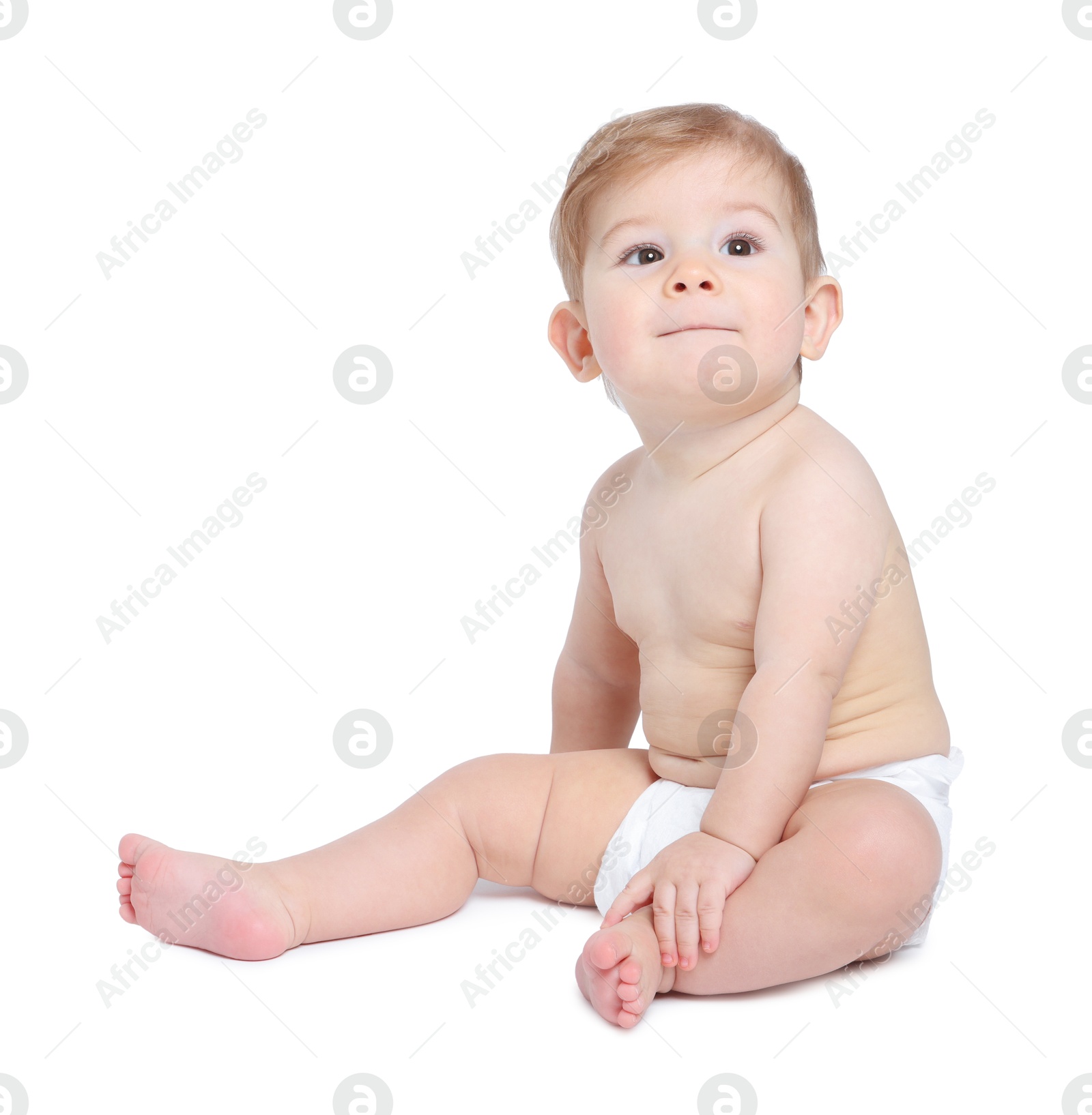 Photo of Cute little baby sitting on white background