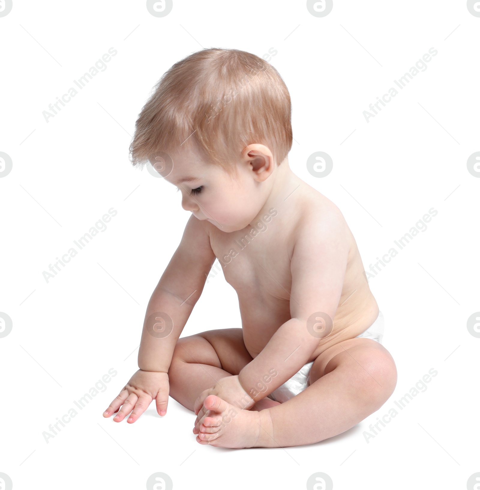 Photo of Cute little baby sitting on white background