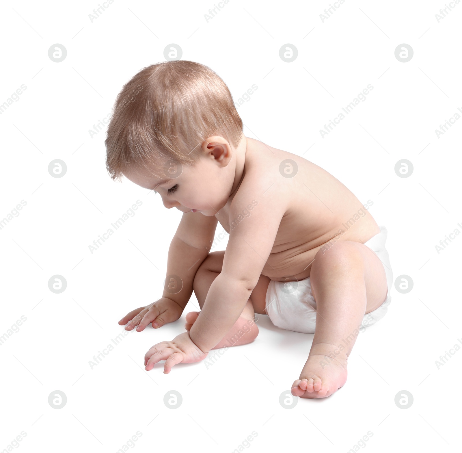 Photo of Cute little baby sitting on white background