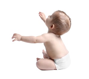 Photo of Adorable little baby sitting on white background