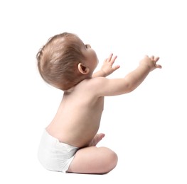 Photo of Adorable little baby sitting on white background