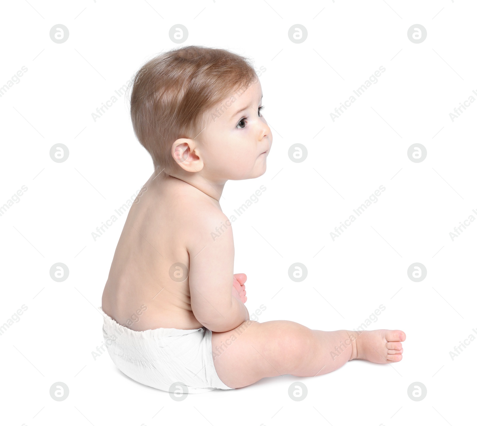 Photo of Cute little baby sitting on white background