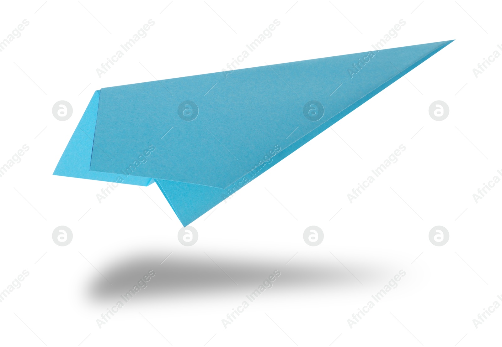 Image of Light blue paper plane in air on white background