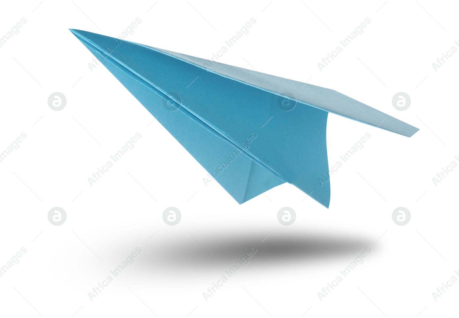 Image of Light blue paper plane in air on white background