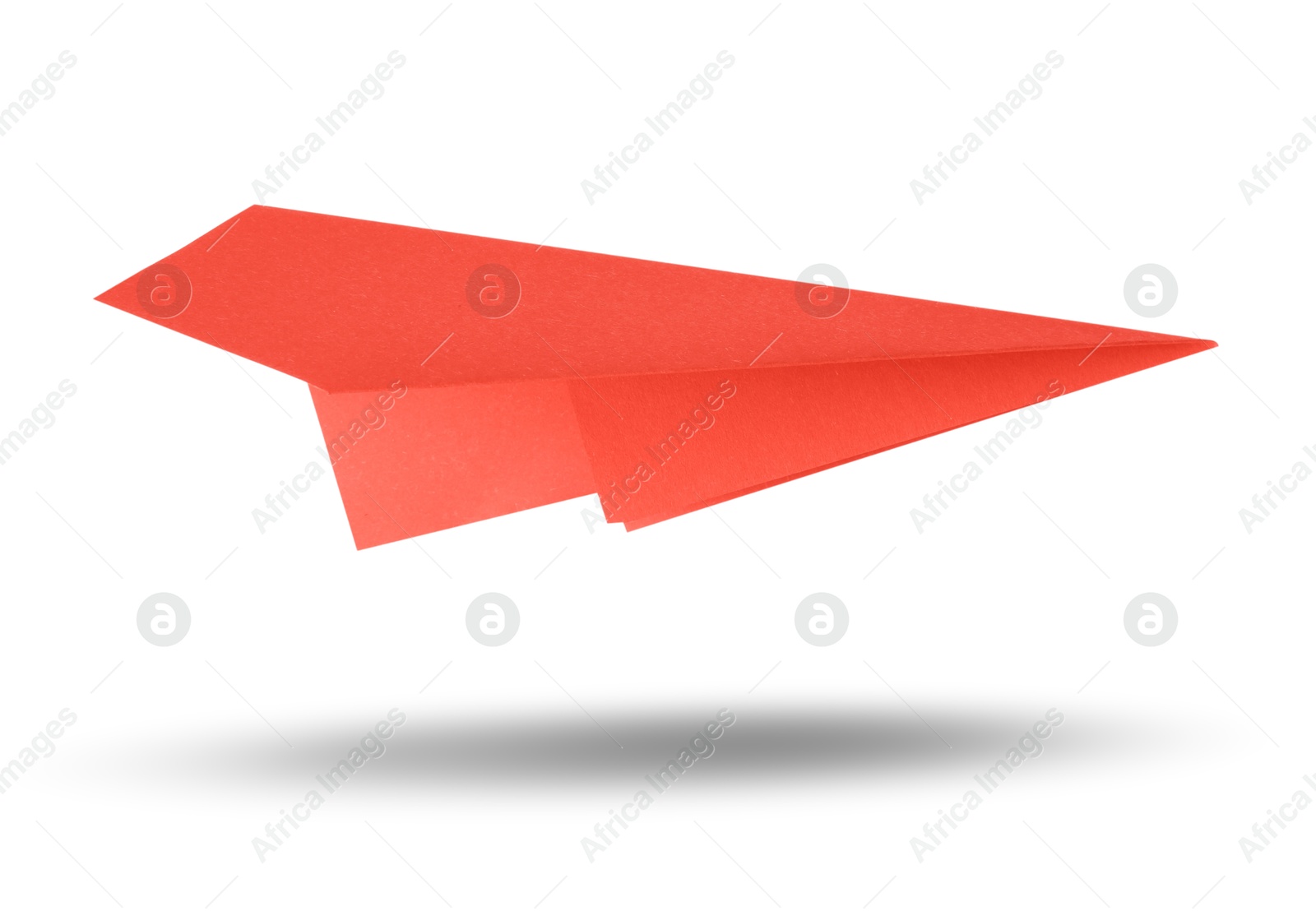 Image of Red paper plane in air on white background