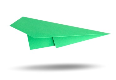 Image of Green paper plane in air on white background