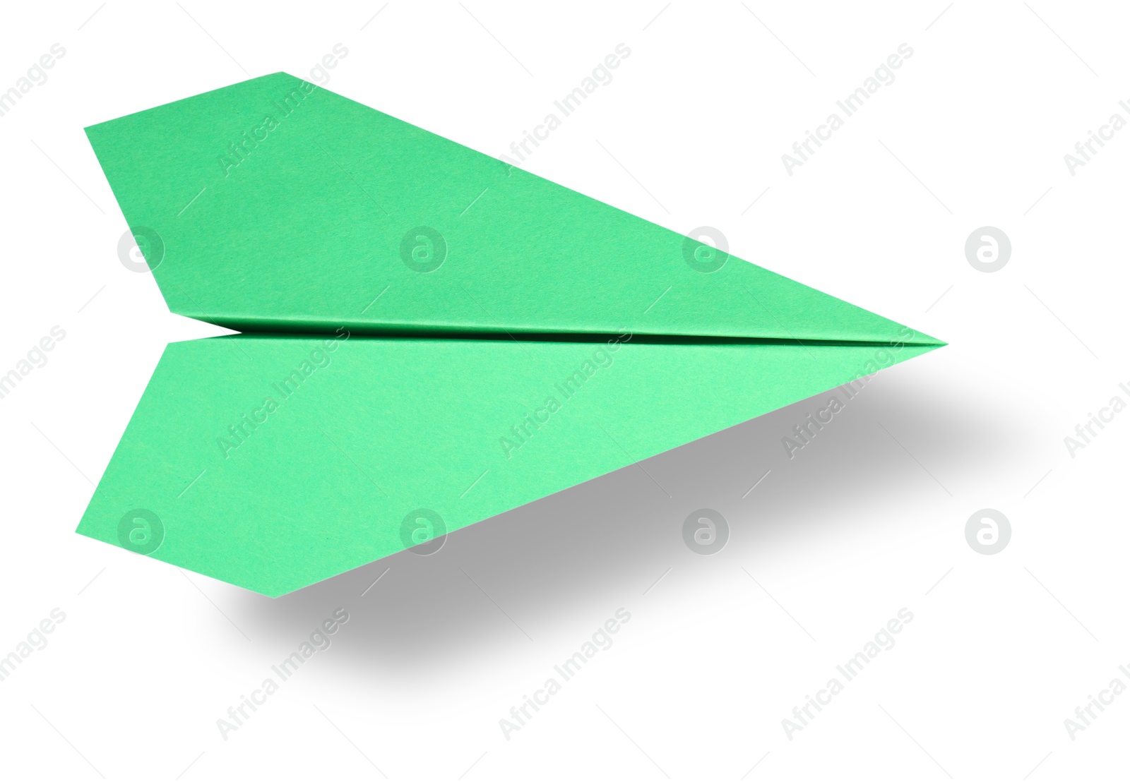 Image of Green paper plane in air on white background