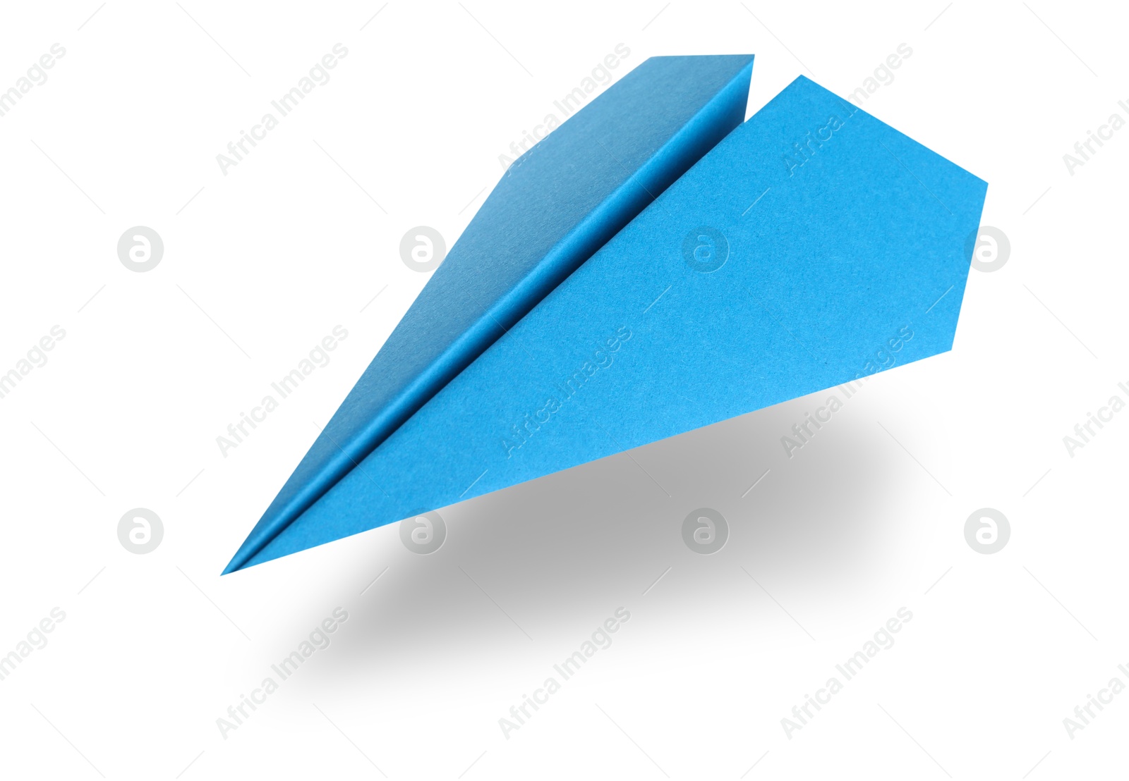 Image of Light blue paper plane in air on white background