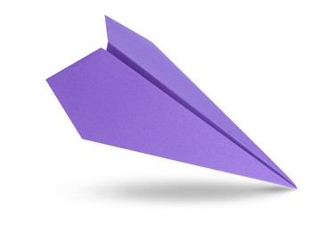 Image of Purple paper plane in air on white background