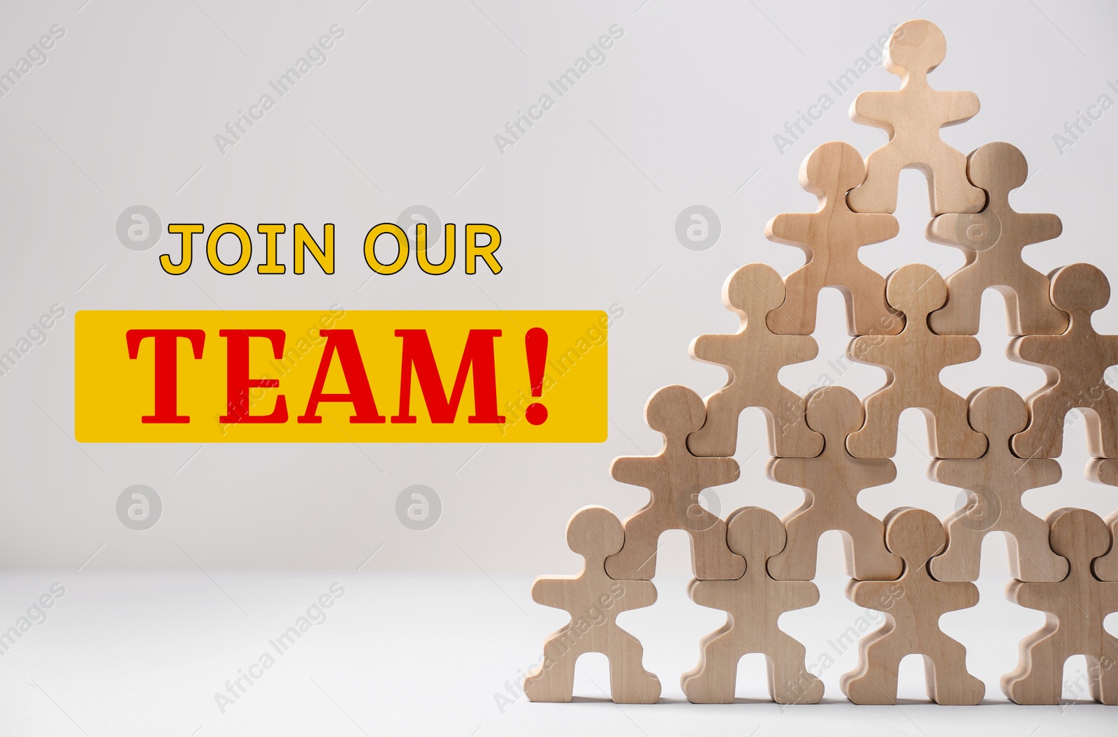 Image of Join our team! Pyramid of wooden human figures on white table. Human resource, recruitment concept