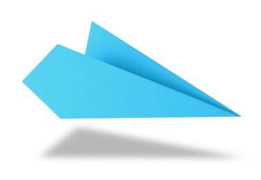 Image of Light blue paper plane in air on white background