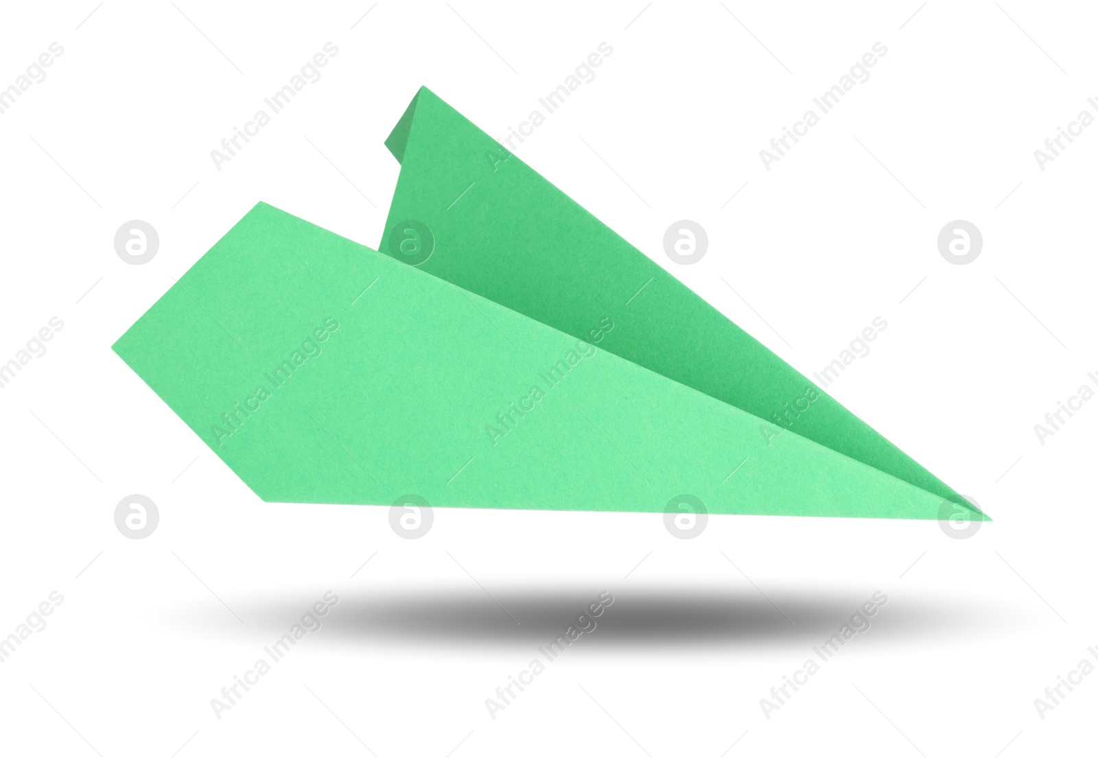 Image of Green paper plane in air on white background