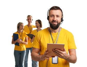 Photo of Technical support call center. Team of friendly operators on white background