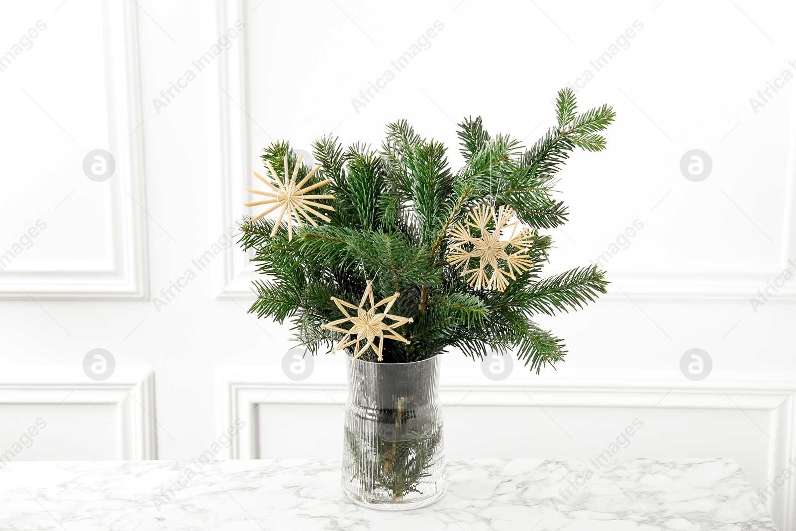 Photo of Beautiful decorated fir tree branches on white table. Christmas season