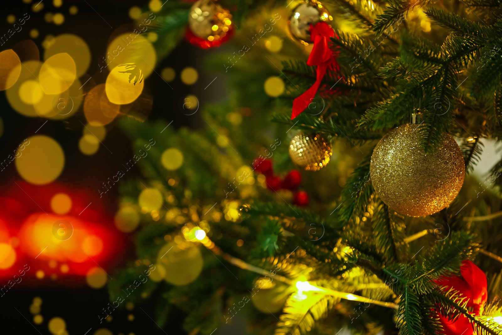 Photo of Beautiful decorated Christmas tree indoors, closeup. Bokeh effect