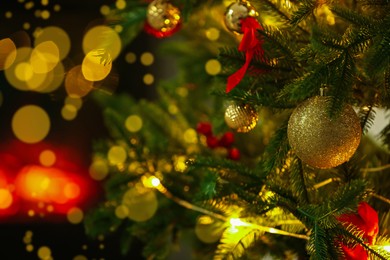 Photo of Beautiful decorated Christmas tree indoors, closeup. Bokeh effect