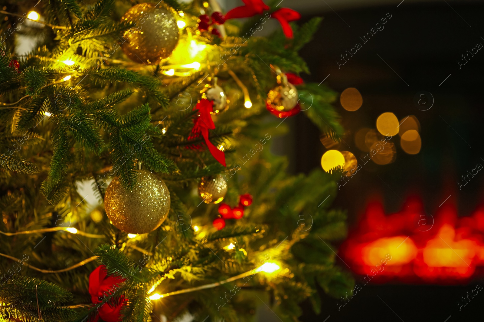 Photo of Beautiful decorated Christmas tree indoors, closeup. Bokeh effect