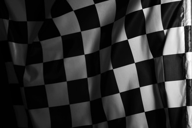 Photo of Racing checkered flag as background, closeup view