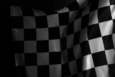 Photo of Racing checkered flag as background, closeup view