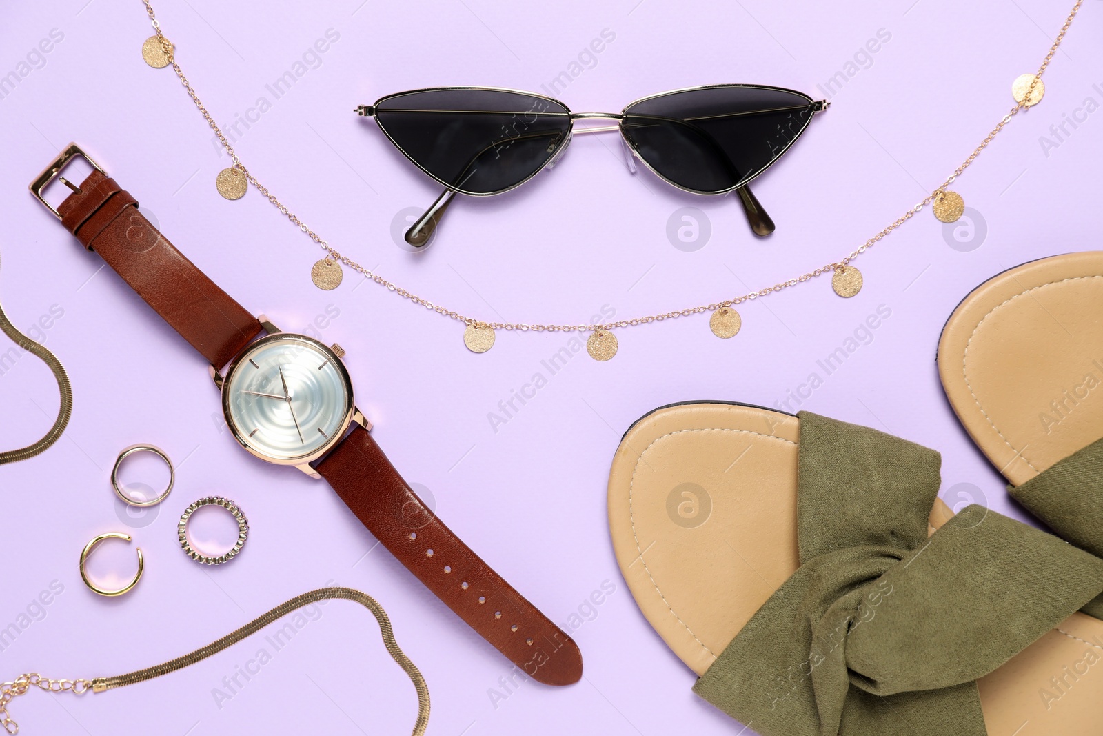 Photo of Flat lay composition with jewelry, accessories and shoes on violet background